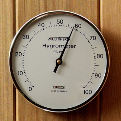 Silver rimmed glass encased hygrometer (4" diam.)